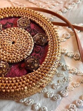 Handwoven Round Rattan Straw Crossbody Bag with Garnet Fabric Inset